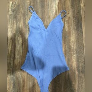 Blue body suit